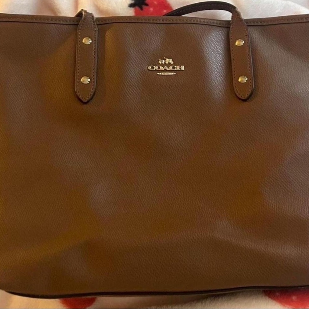 Coach Brown Leather Bags with Structured Silhouettes and Metal Accents